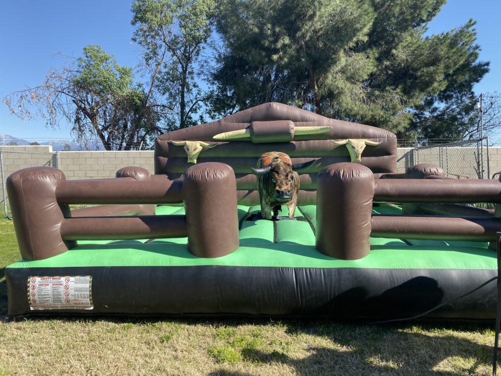 Popular Mechanical Bull rental available near you! Mechanical Bull with fur is always a hit! Size 16x16